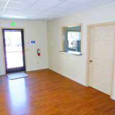 Remodeled downtown Ukiah accounting office showing the front door and the service window.